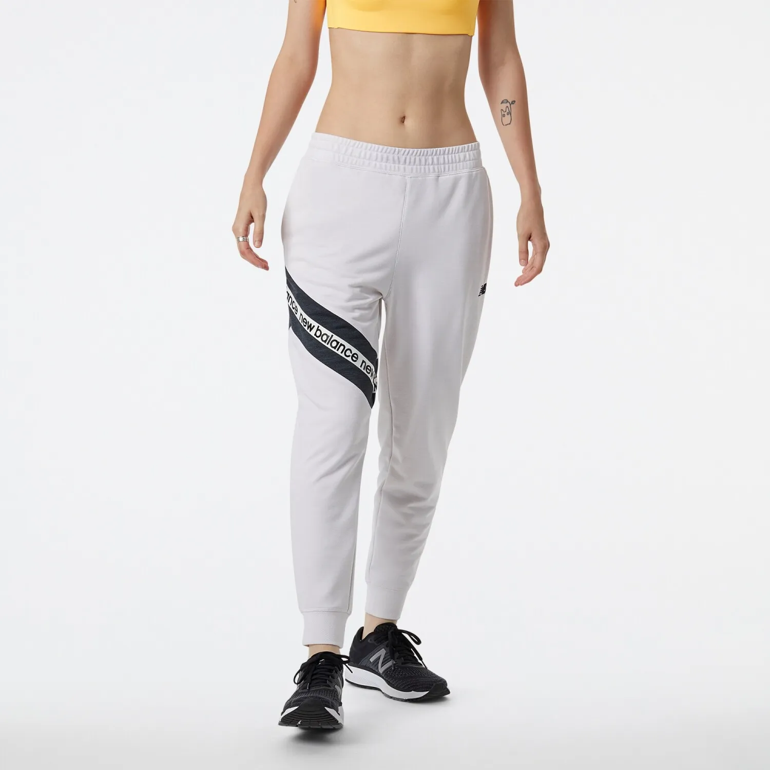 PANTALóN NEW BALANCE DE DAMA RELENTLESS TERRY  WP21180SST  WHITE