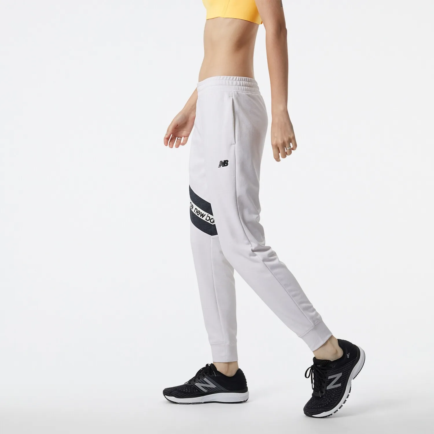 PANTALóN NEW BALANCE DE DAMA RELENTLESS TERRY  WP21180SST  WHITE
