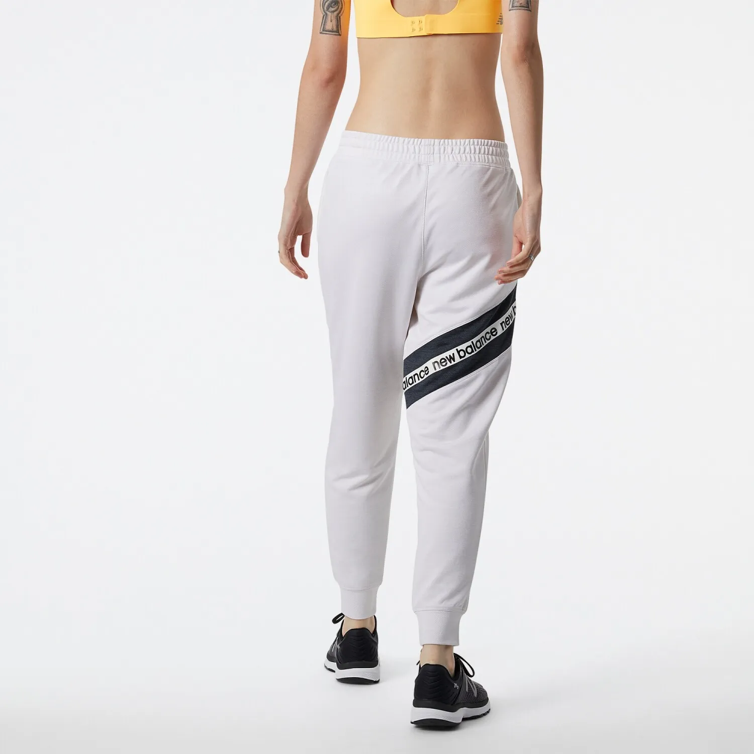 PANTALóN NEW BALANCE DE DAMA RELENTLESS TERRY  WP21180SST  WHITE